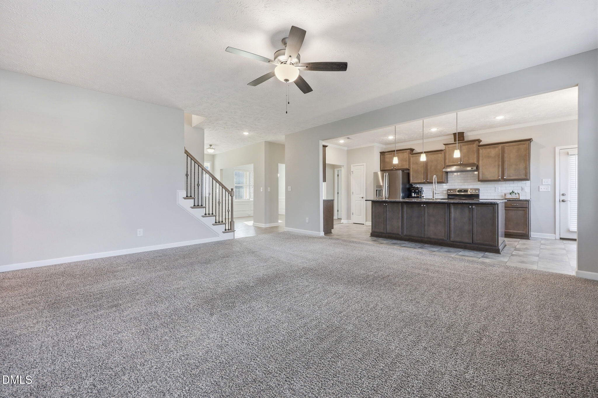 3017 Branscombe Road Fayetteville, NC 28304 - Photo 6 of 43 a view of a kitchen with a sink and a ceiling fan