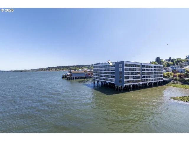 a view of a terrace with wooden floor and a view of city