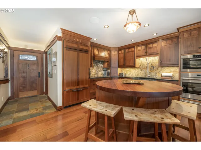 a view of a dining room with furniture and a large window