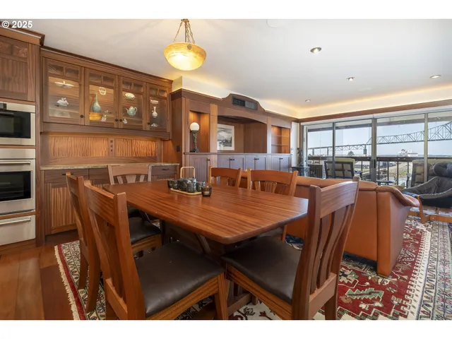 a kitchen with granite countertop wooden cabinets and white appliances