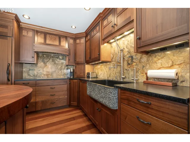 a living room with wooden floor and furniture