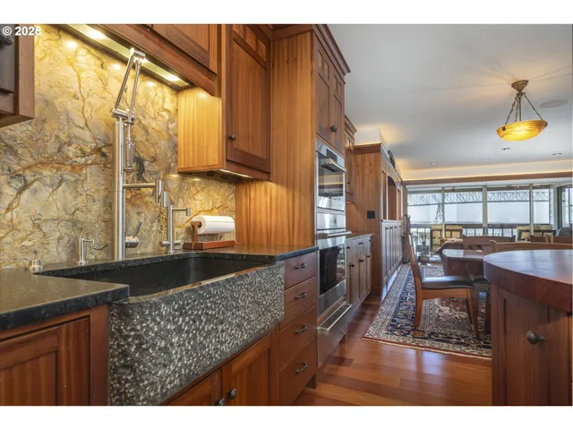 a view of a dining room with furniture and window