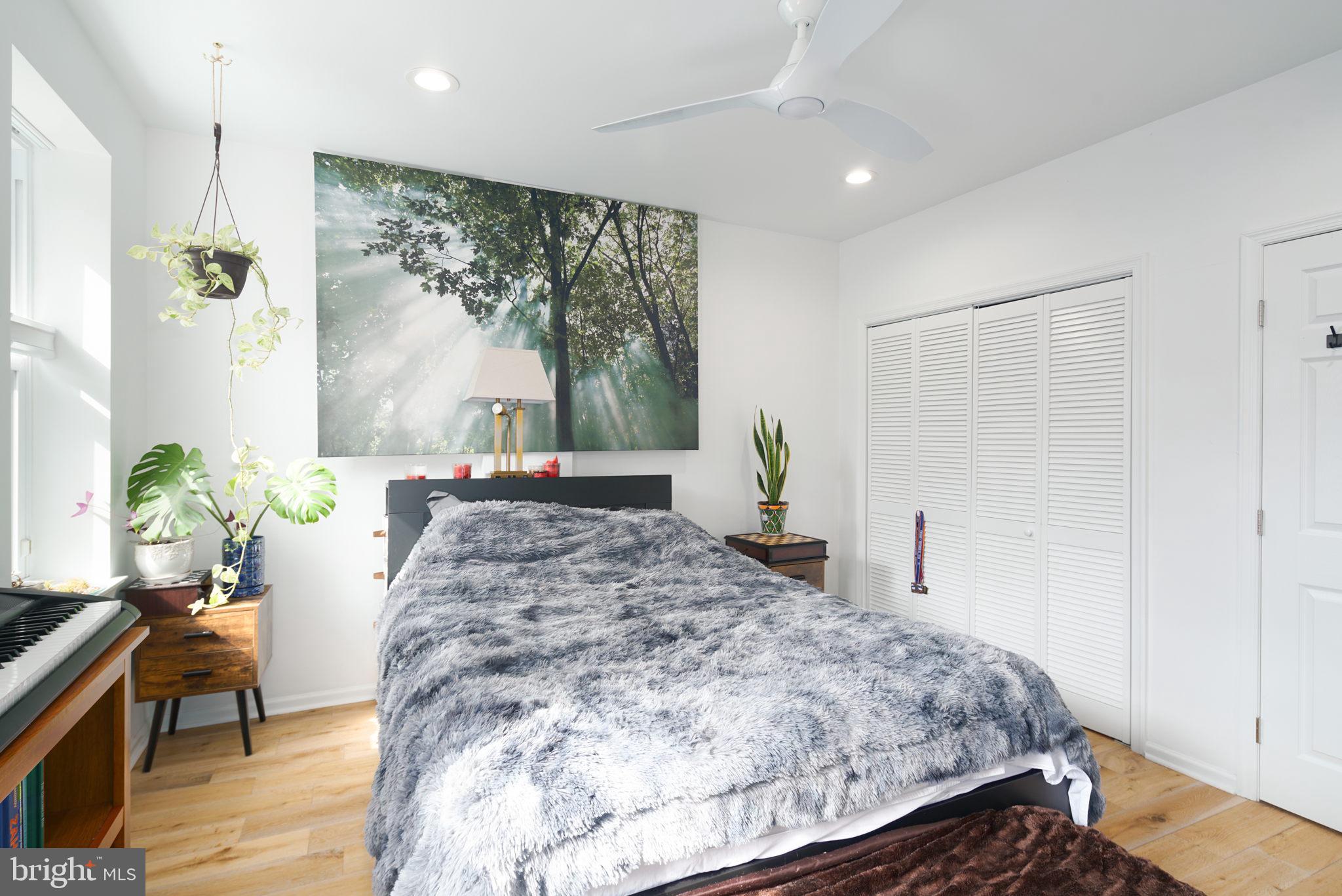 3045 Baltz Street Philadelphia, PA 19121 - Photo 11 of 18 a bed sitting in a spacious bedroom next to a window