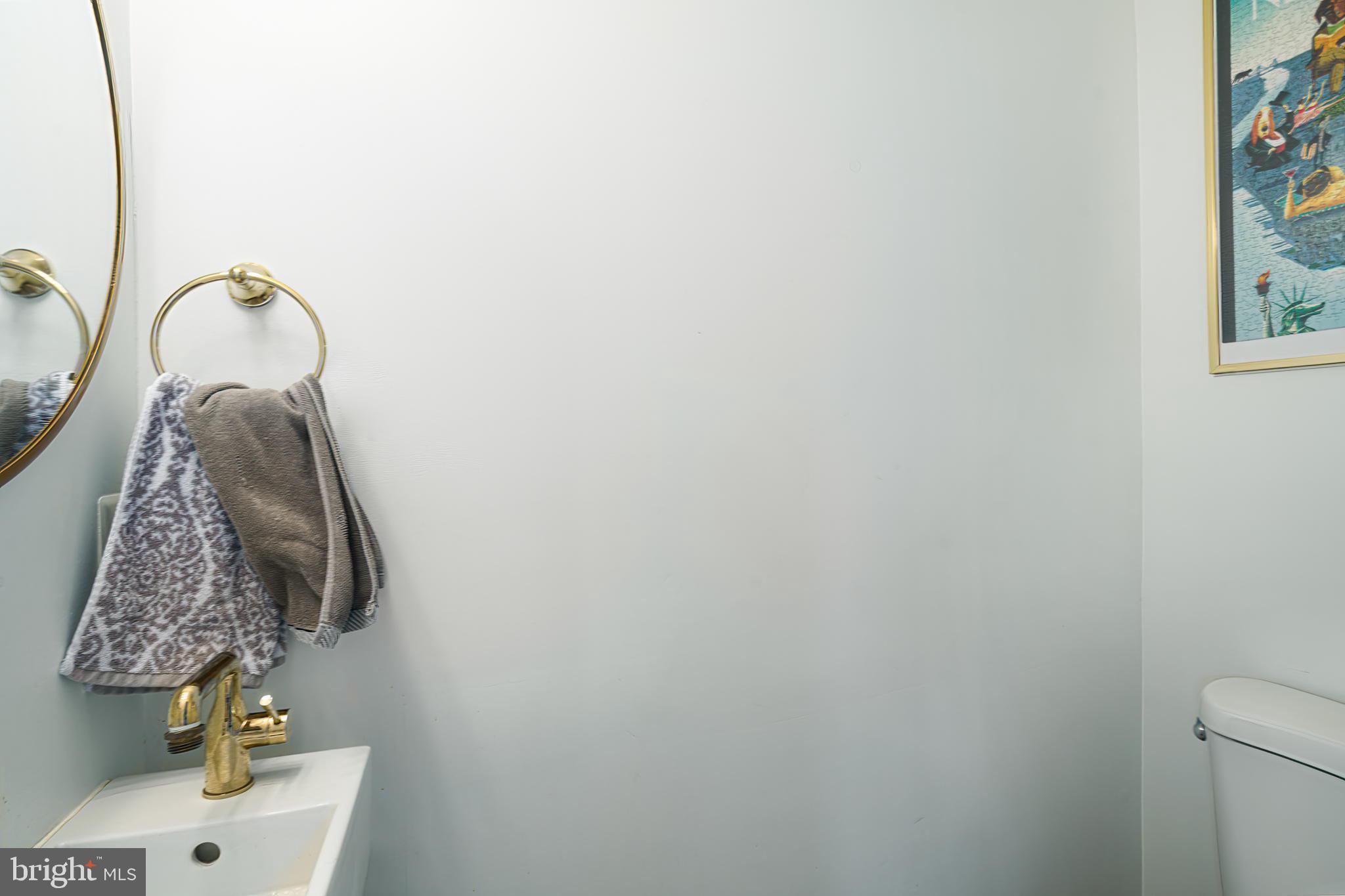 3045 Baltz Street Philadelphia, PA 19121 - Photo 12 of 18 a bathroom with a shower curtain and a sink