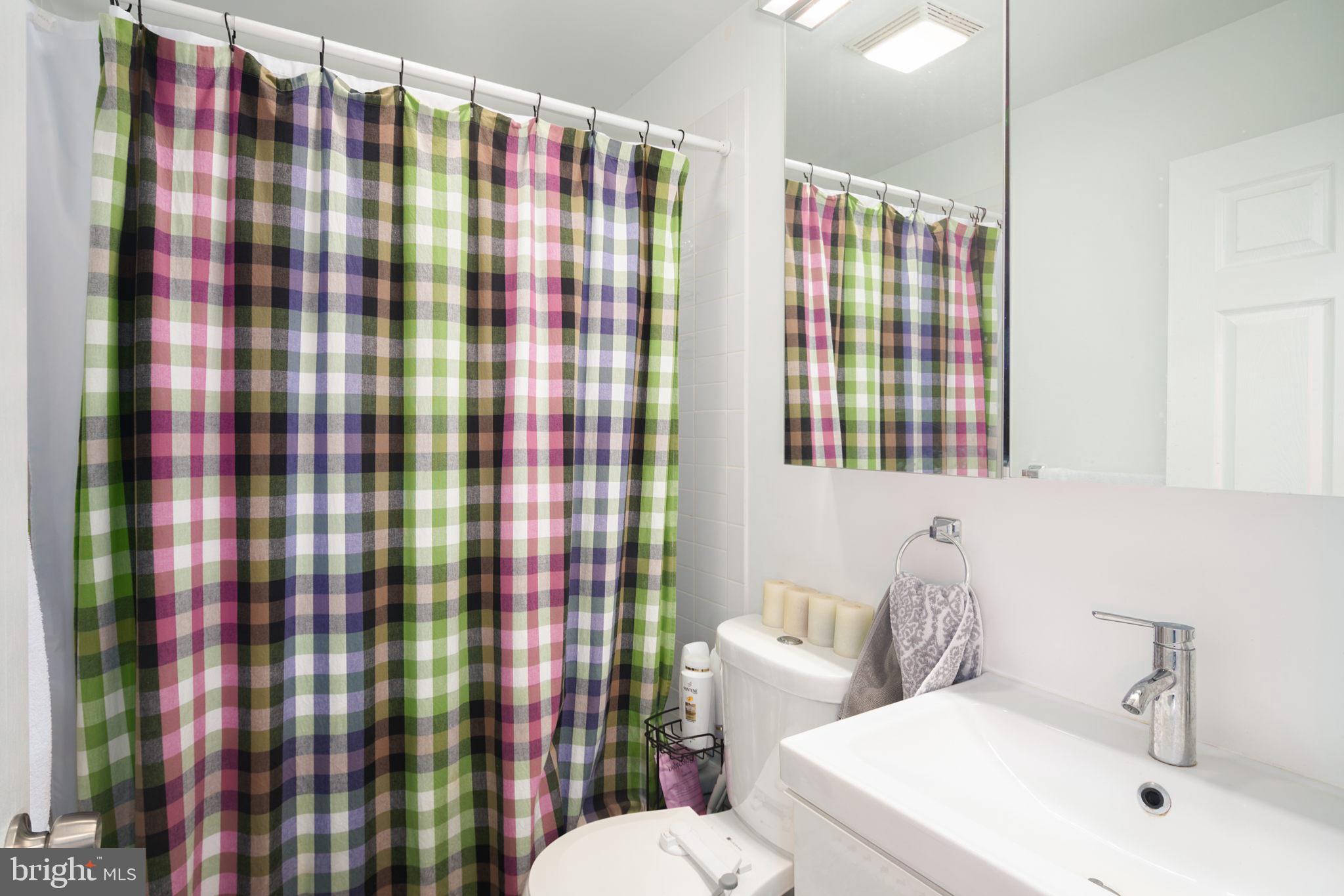 3045 Baltz Street Philadelphia, PA 19121 - Photo 9 of 18 a bathroom with a sink toilet and shower