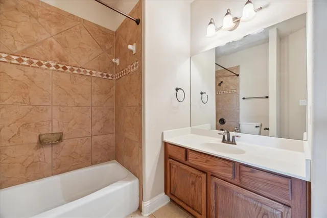 an empty room with a window and a ceiling fan