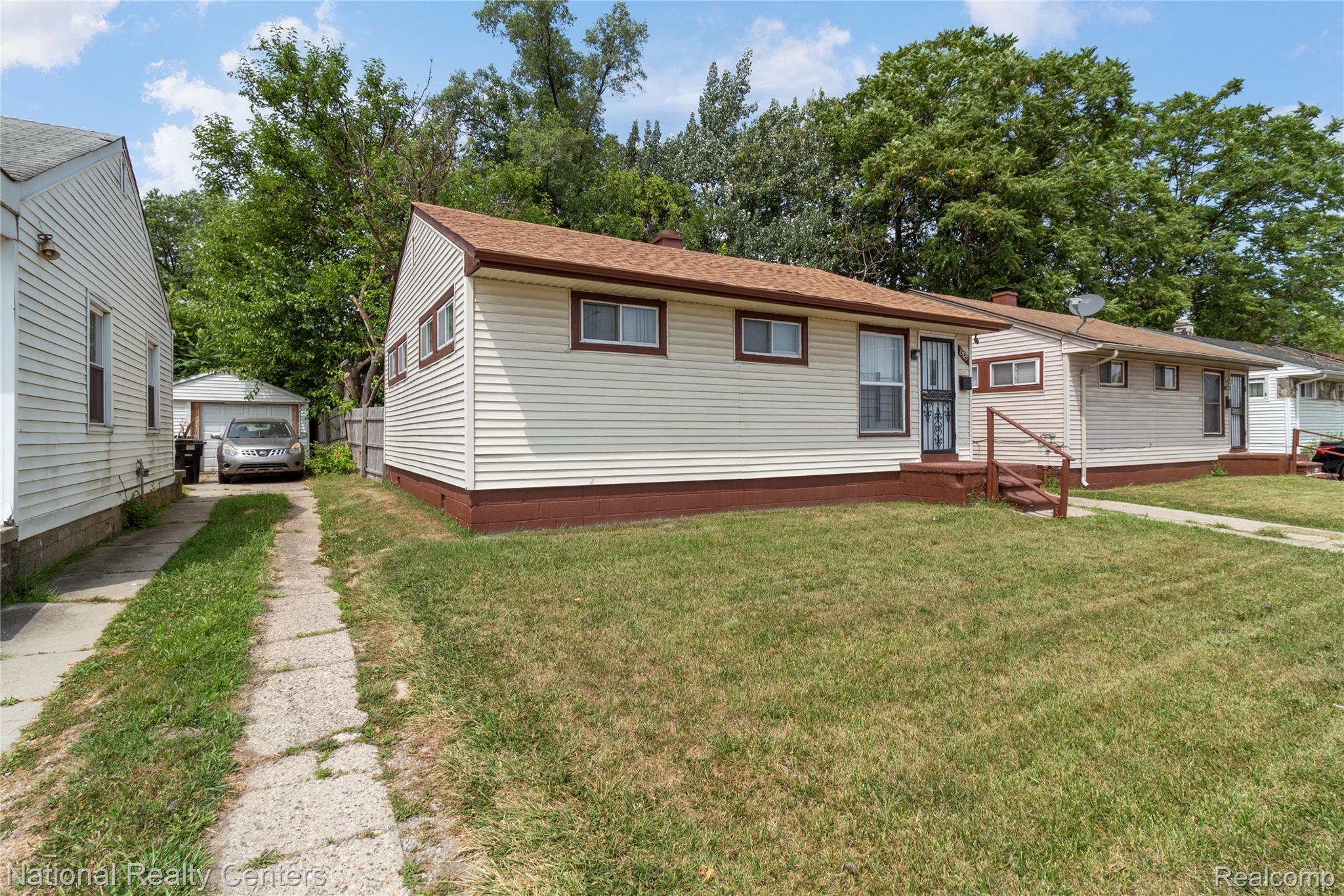 13525 Evergreen Road Detroit, MI 48223 - Photo 25 of 25 Single-story residence featuring light-colored siding, a brown roof, and trim