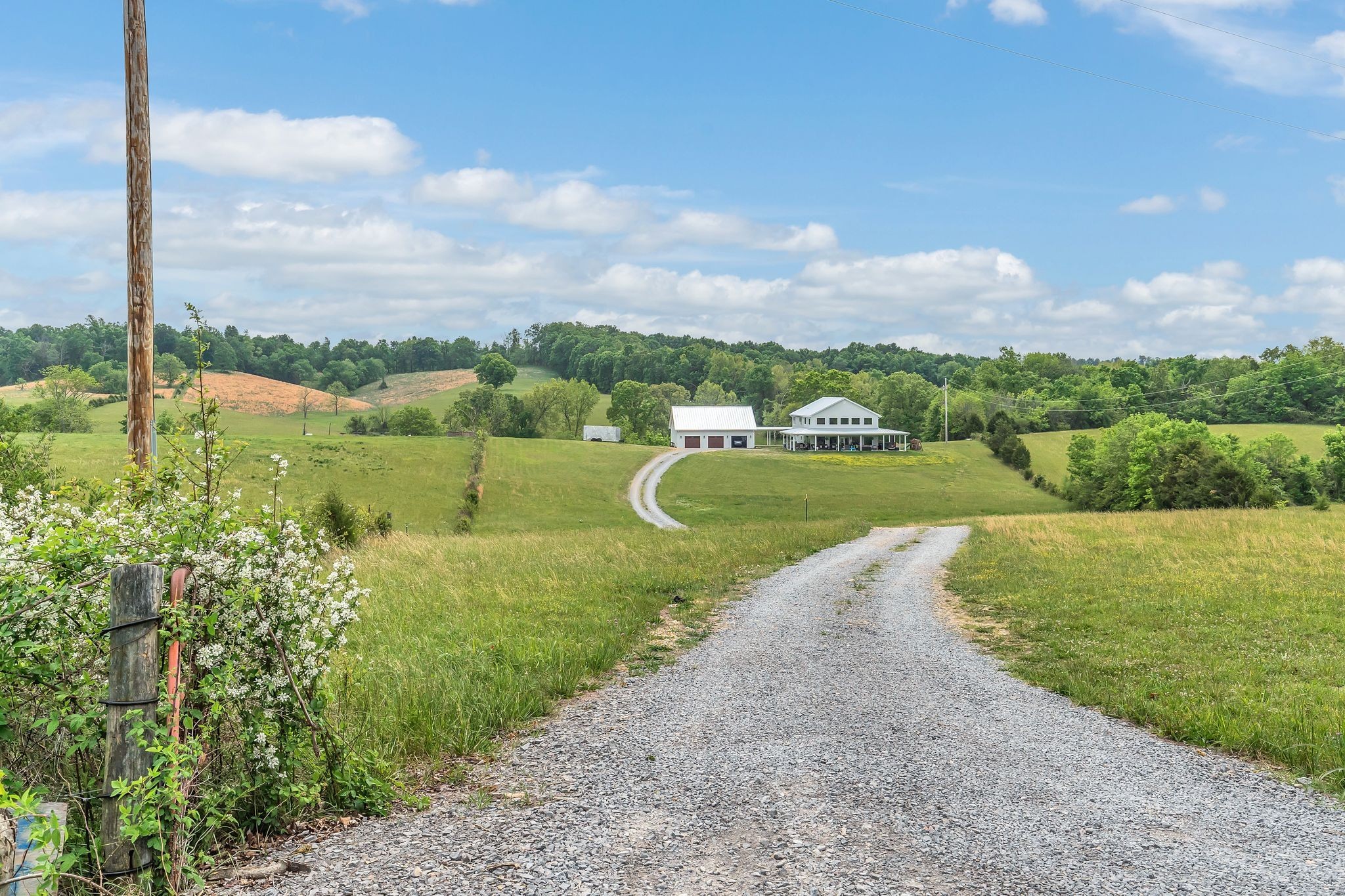 1528 Fairfield Road Westmoreland, TN 37186 - Photo 30 of 41 a view of a lake with a houses in the background