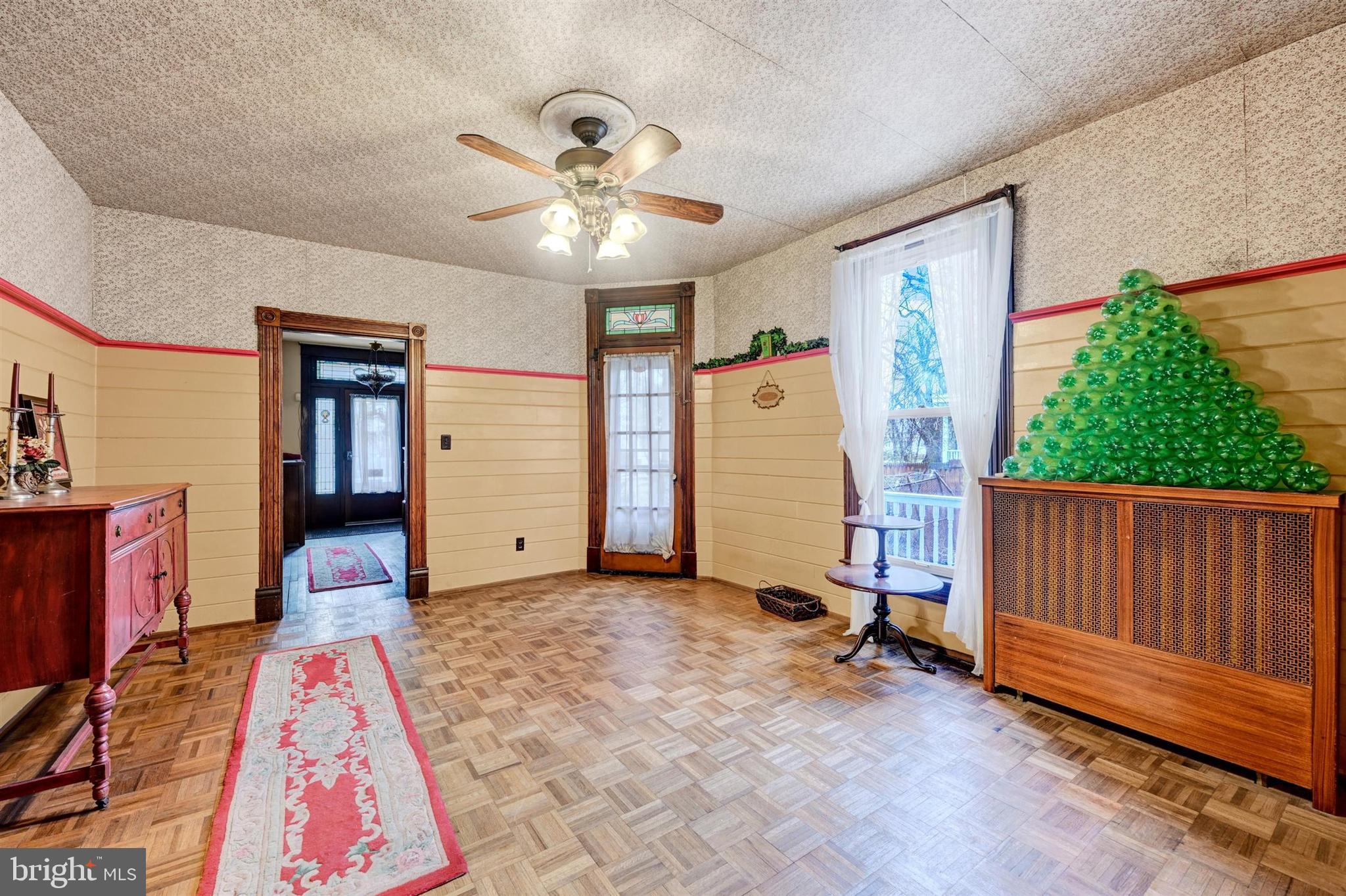 6406 Old Harford Road Baltimore, MD 21214 - Photo 14 of 26 a view of a workspace with furniture and a rug