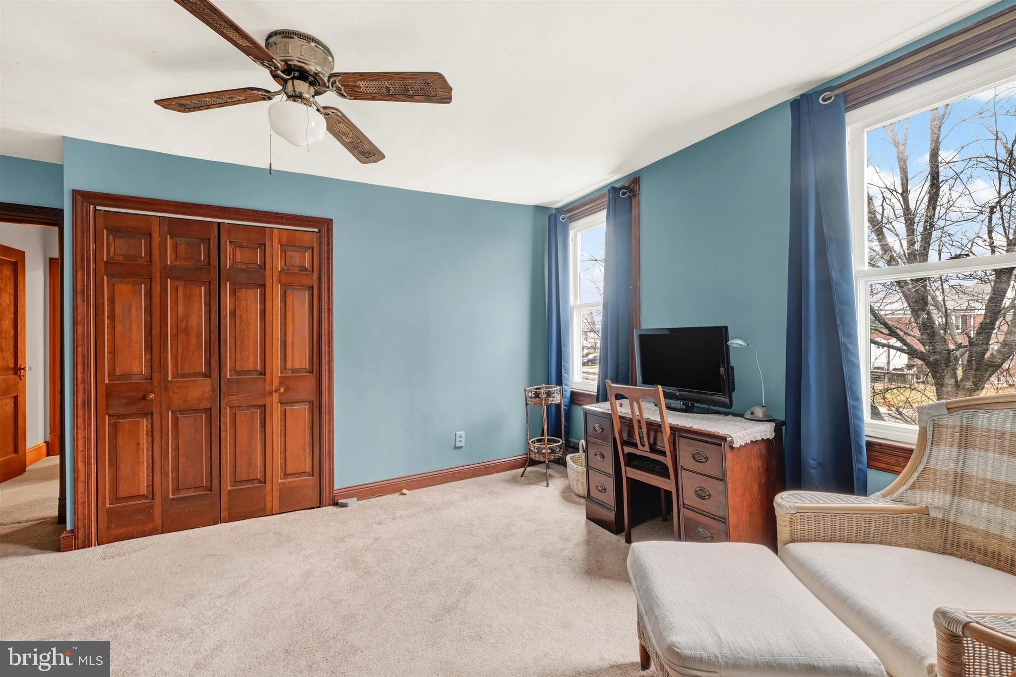 6406 Old Harford Road Baltimore, MD 21214 - Photo 22 of 26 a bedroom with furniture and a flat screen tv