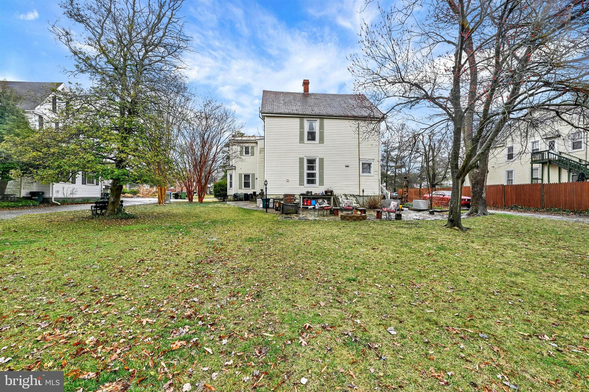 6406 Old Harford Road Baltimore, MD 21214 - Photo 24 of 26 a front view of a house with a garden and trees