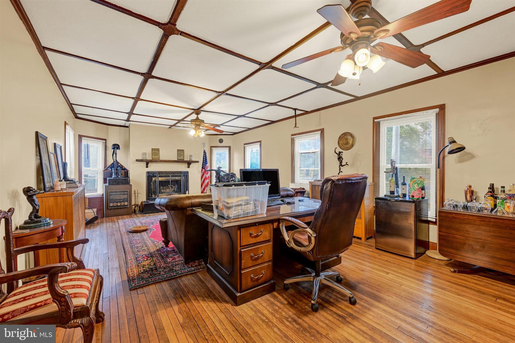 6406 Old Harford Road Baltimore, MD 21214 - Photo 7 of 26 a work room with furniture and wooden floor