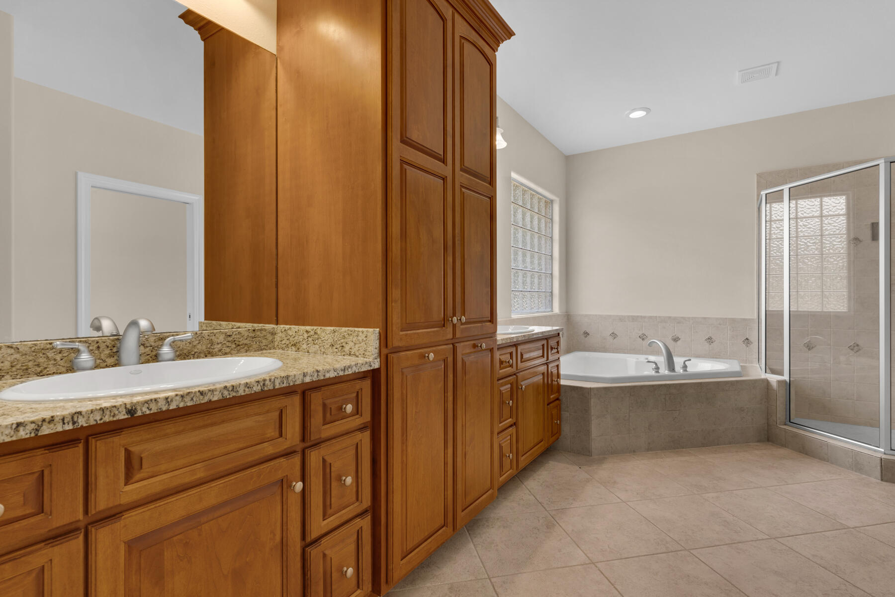 155 Club House Drive East Freeport, FL 32439 - Photo 17 of 34 a bathroom with a granite countertop bathtub sink double and mirror