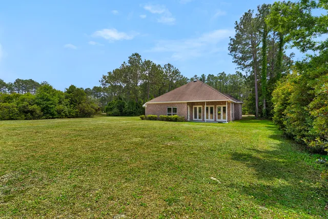 an aerial view of lake residential houses with outdoor space and swimming pool
