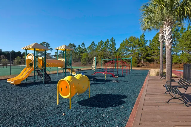 a swimming pool with outdoor seating and yard
