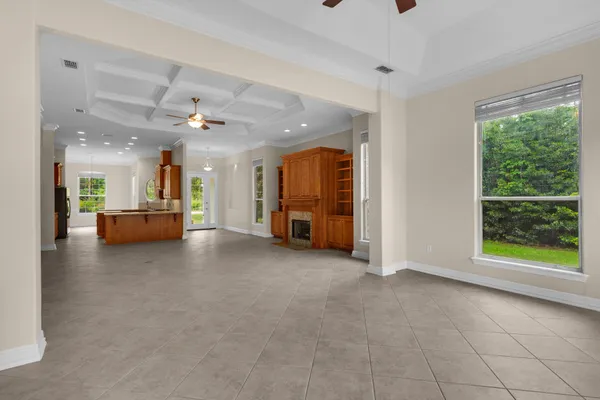 a view of a livingroom with furniture and a window