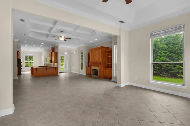 a view of a livingroom with furniture and a window