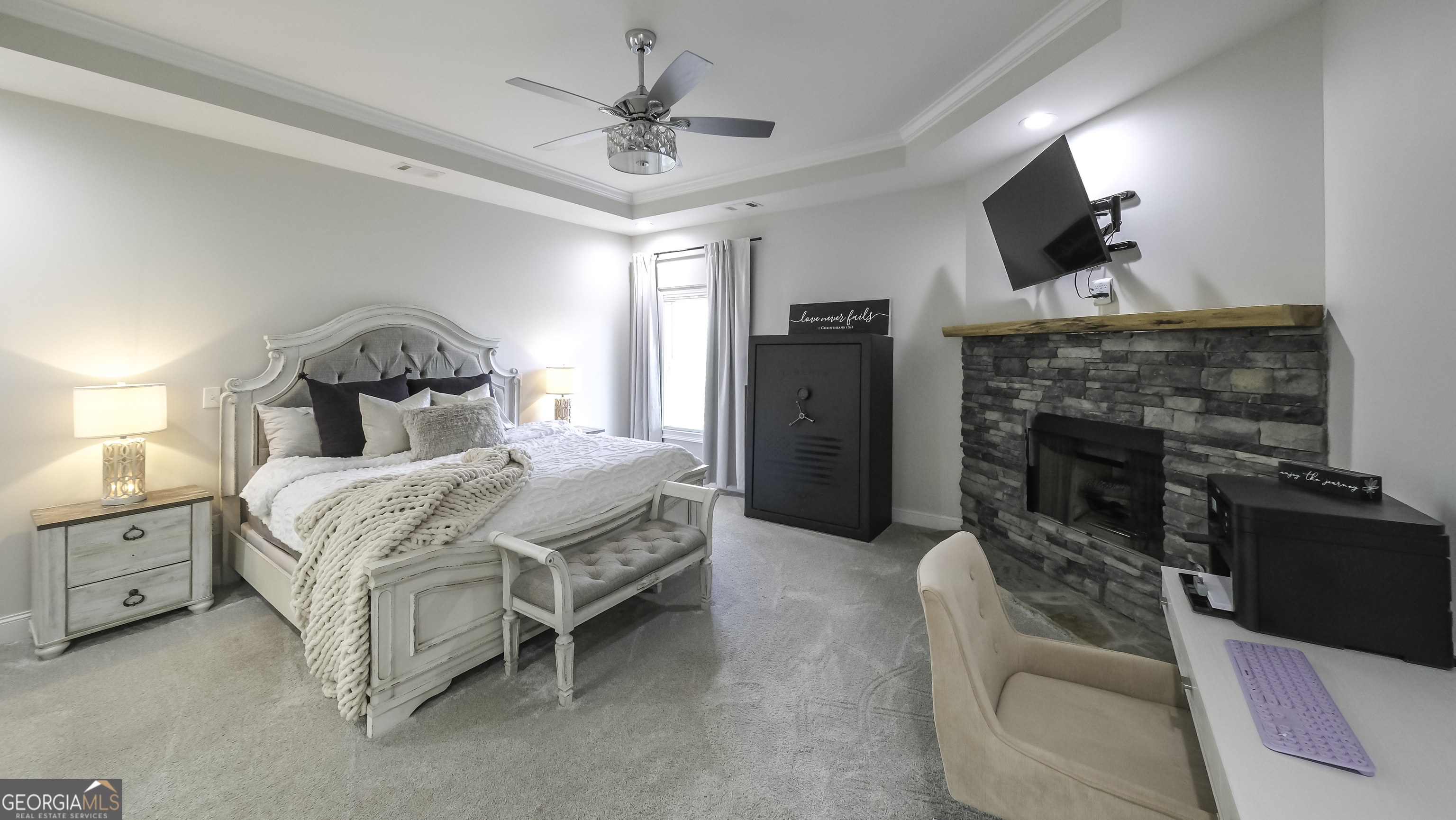 2392 Welcome Road Roopville, GA 30170 - Photo 22 of 43 a bedroom with a bed fireplace and window