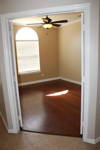 a view of empty space with wooden floor