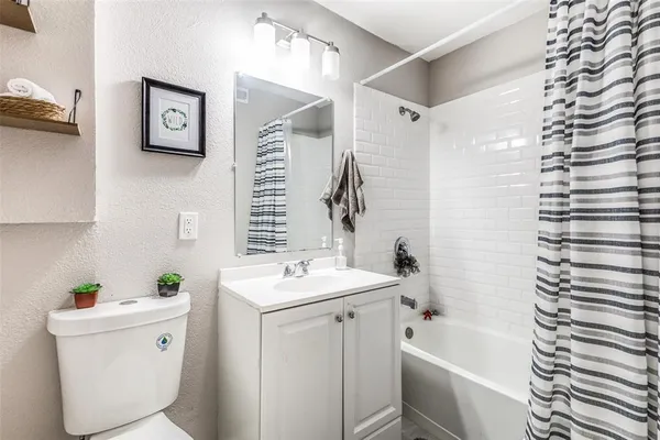 a bathroom with a sink vanity and a mirror