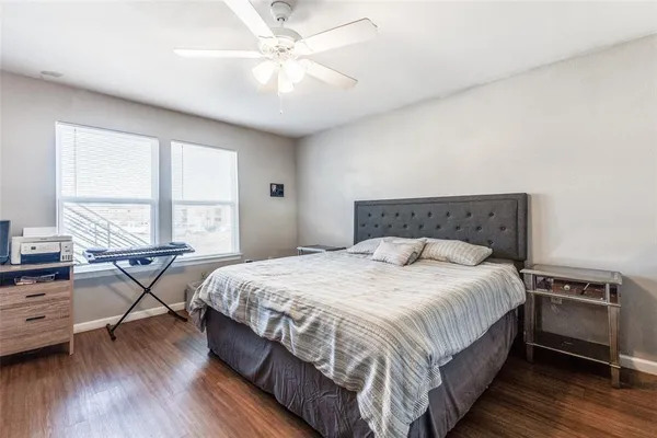 a bedroom with a bed and a tv