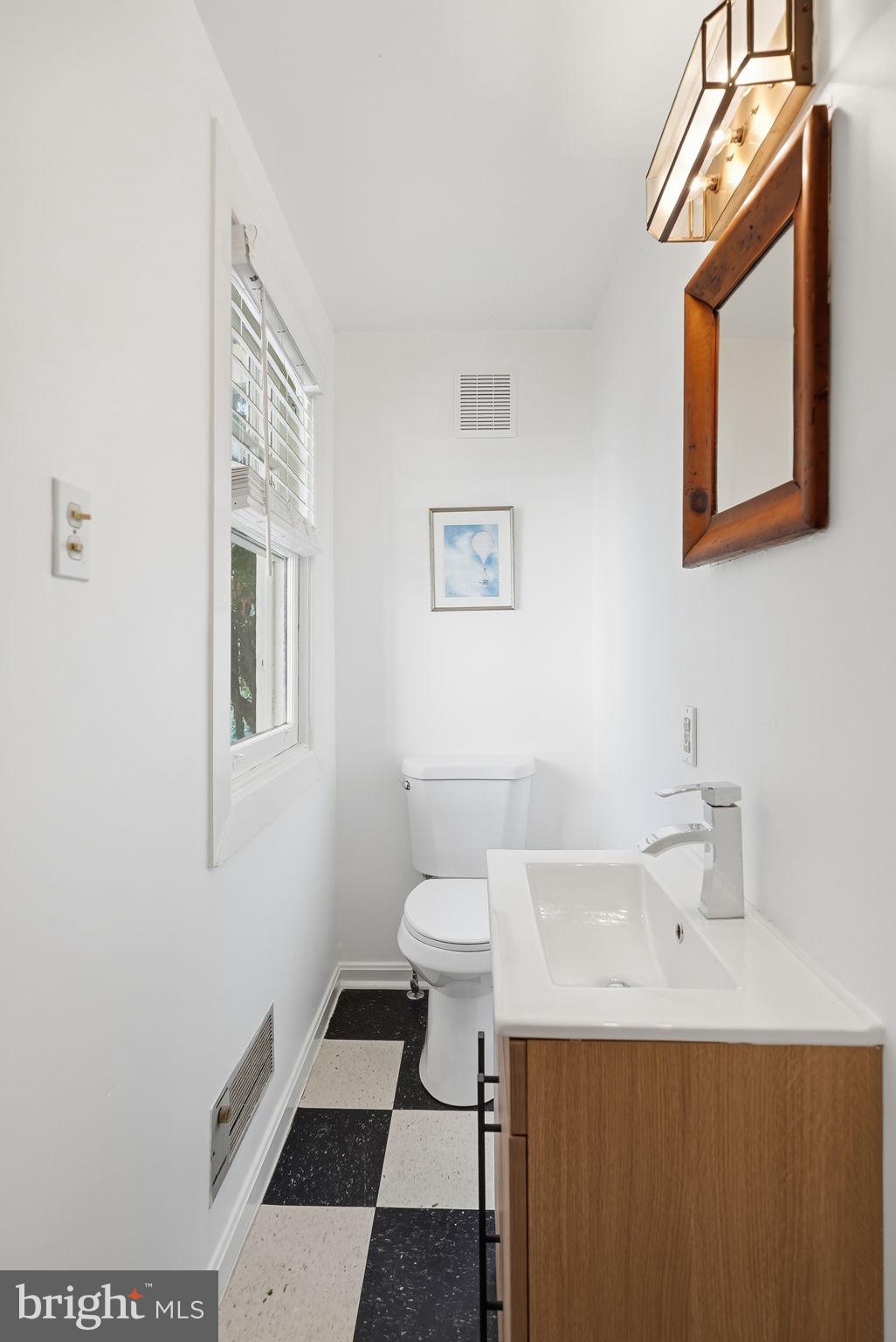 6814 Brookville Road Chevy Chase, MD 20815 - Photo 15 of 39 Sleek and modern half-bath retreat.
