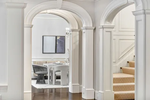 a view of entryway with wooden floor and furniture