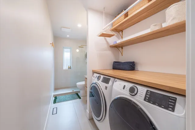 a utility room with dryer and washer