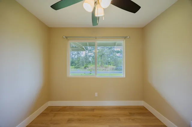 a front view of a house with a yard table and chairs