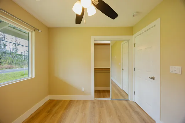 a swimming pool that is in front of house