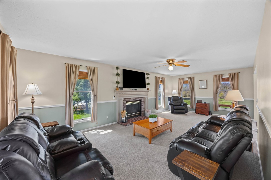 1113 Erie Street Road Macedon, NY 14502 - Photo 13 of 50 This expansive living room spans the full depth of