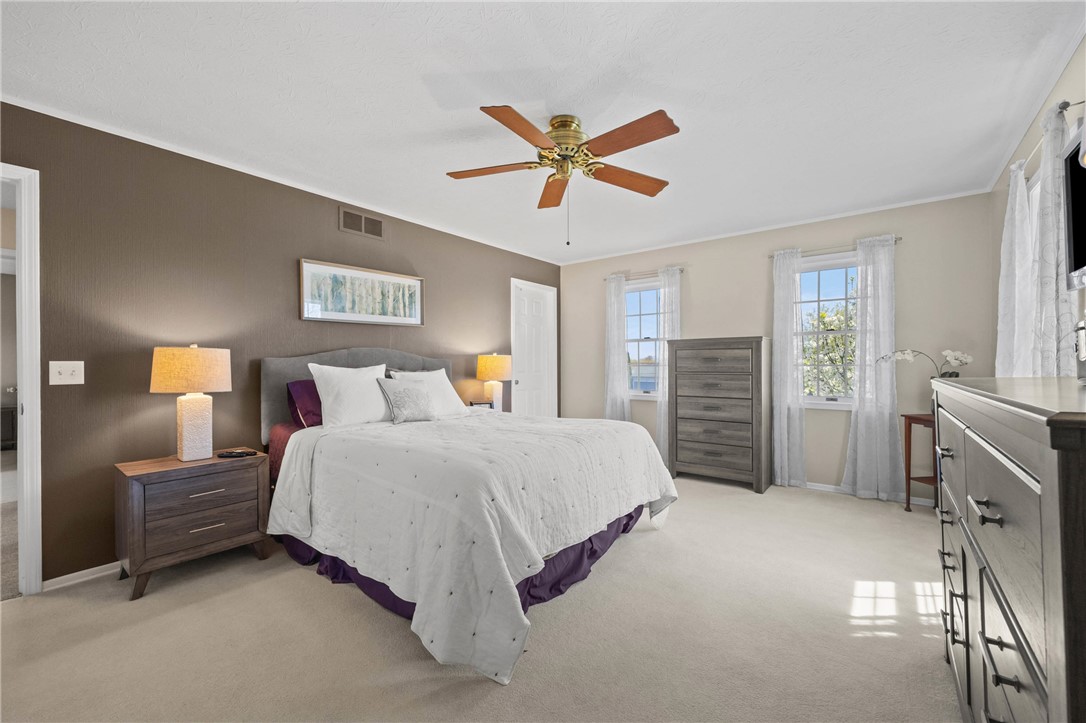 1113 Erie Street Road Macedon, NY 14502 - Photo 19 of 50 The spacious primary suite offers a true retreat w