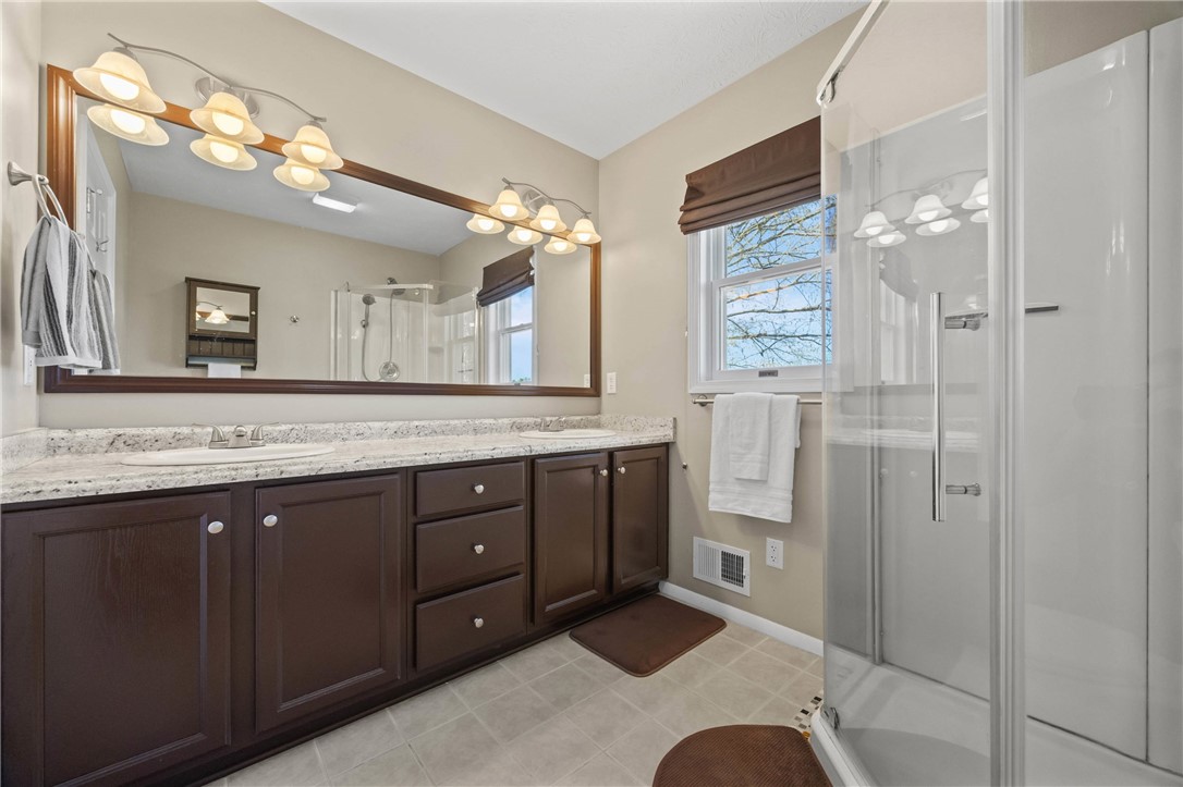 1113 Erie Street Road Macedon, NY 14502 - Photo 22 of 50 The primary bathroom is both spacious and function
