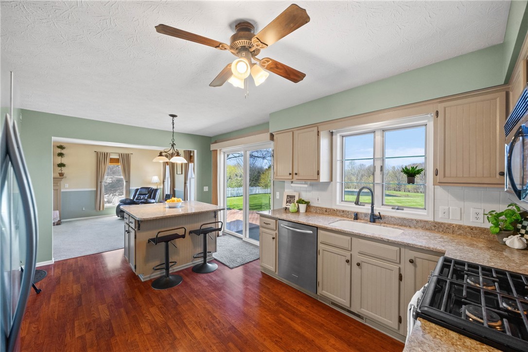 1113 Erie Street Road Macedon, NY 14502 - Photo 7 of 50 A charming farmhouse kitchen with a view. Warm cab
