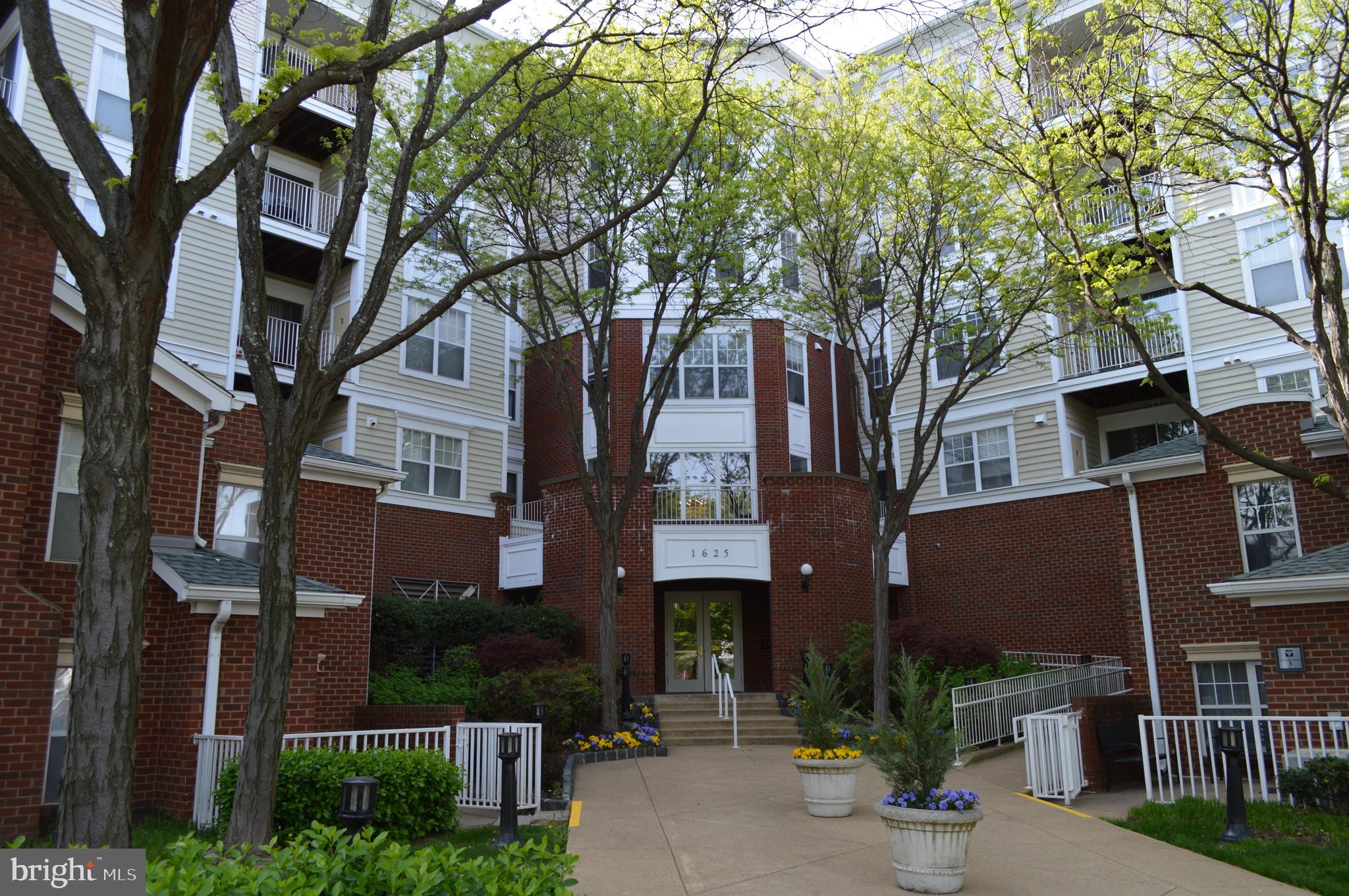 a front view of a multi story residential apartment buildings
