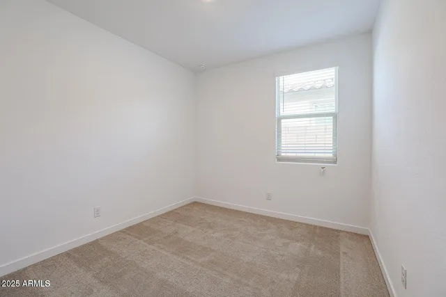 an empty room with closet area
