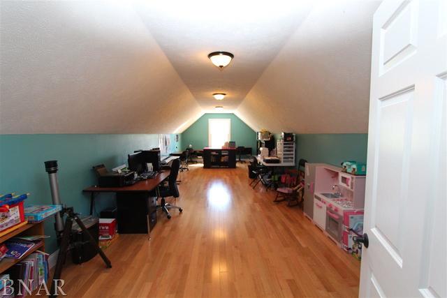 10821 Corner Post Road Clinton, IL 61727 - Photo 22 of 30 a living room with furniture and a wooden floor