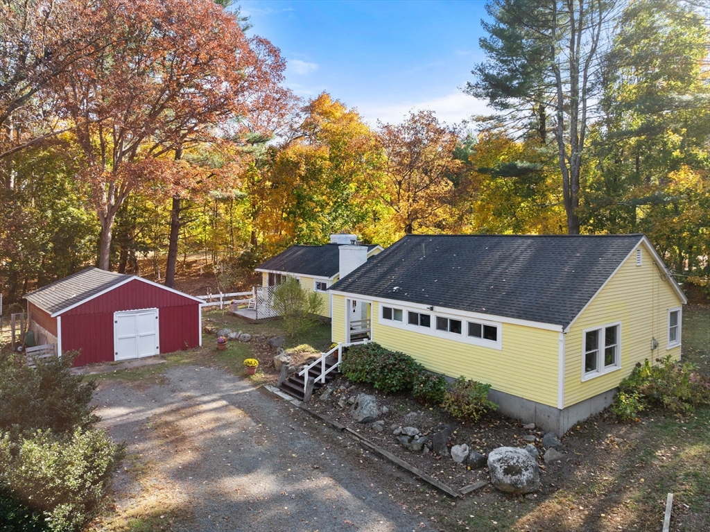 142 Plain Road Wayland, MA 01778 - Photo 1 of 14 a house that has a tree in front of it