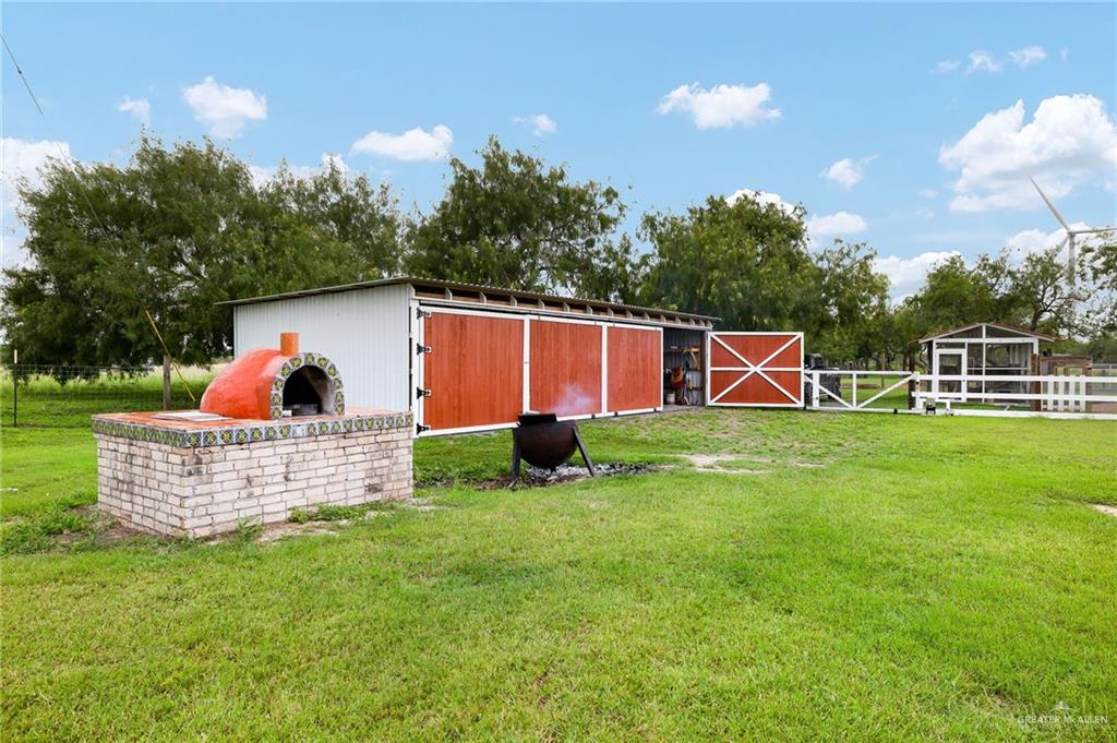 22172 North Olmito Road Rio Hondo, TX 78583 - Photo 27 of 33 a view of a house with backyard