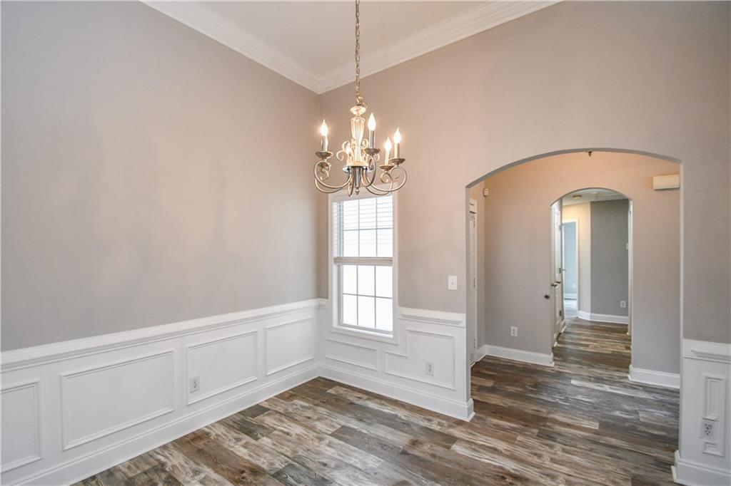75 Ashebrooke Way Jefferson, GA 30549 - Photo 12 of 84 a room with chandelier and wooden floor