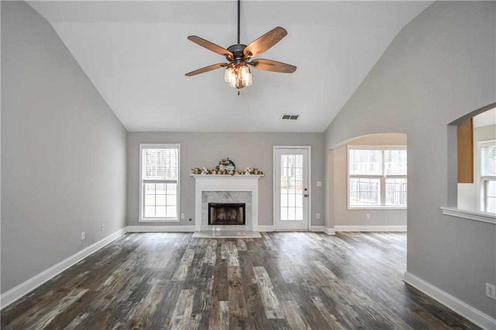 75 Ashebrooke Way Jefferson, GA 30549 - Photo 17 of 84 a view of an empty room with window and wooden floor