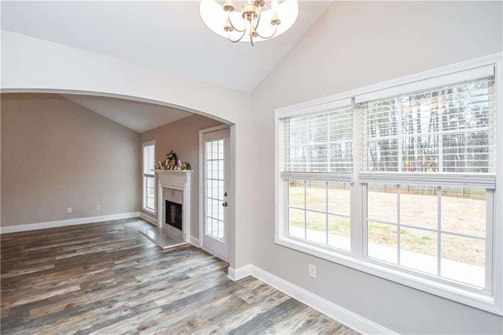 75 Ashebrooke Way Jefferson, GA 30549 - Photo 36 of 84 a view of empty room with fireplace and windows
