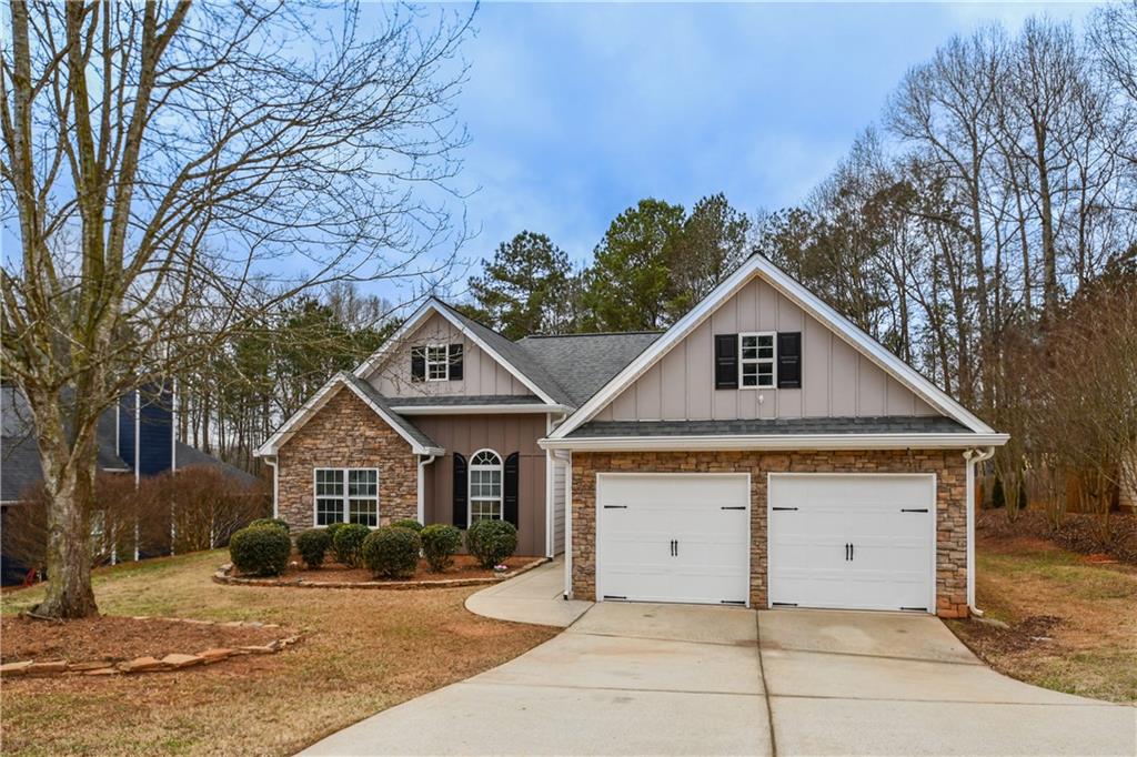 75 Ashebrooke Way Jefferson, GA 30549 - Photo 4 of 84 a front view of a house with a yard and garage