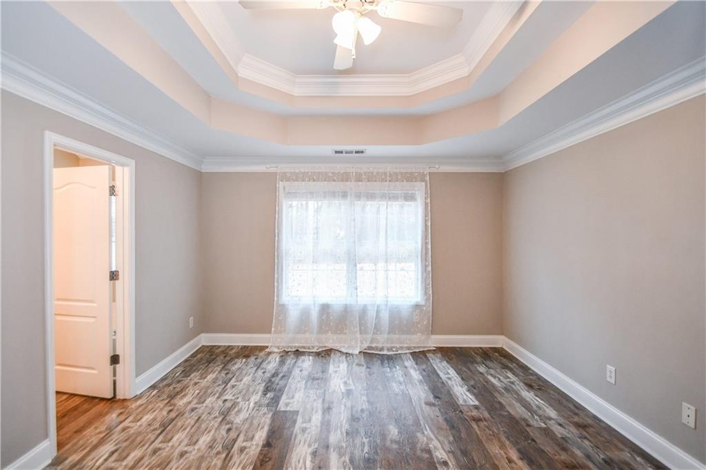75 Ashebrooke Way Jefferson, GA 30549 - Photo 43 of 84 a view of empty room with wooden floor and fan