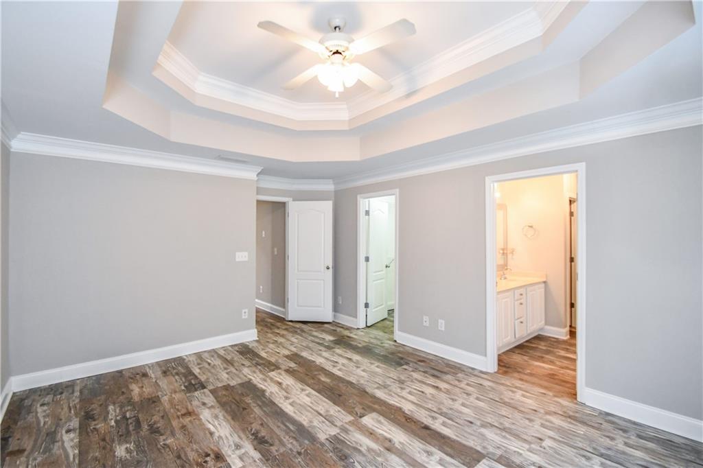 75 Ashebrooke Way Jefferson, GA 30549 - Photo 45 of 84 a view of a room with wooden floor and a ceiling fan
