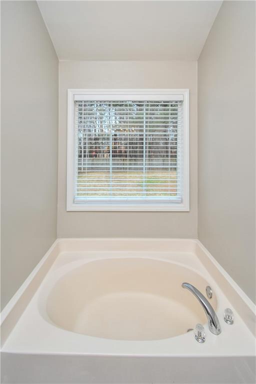 75 Ashebrooke Way Jefferson, GA 30549 - Photo 49 of 84 a white bath tub sitting next to a window