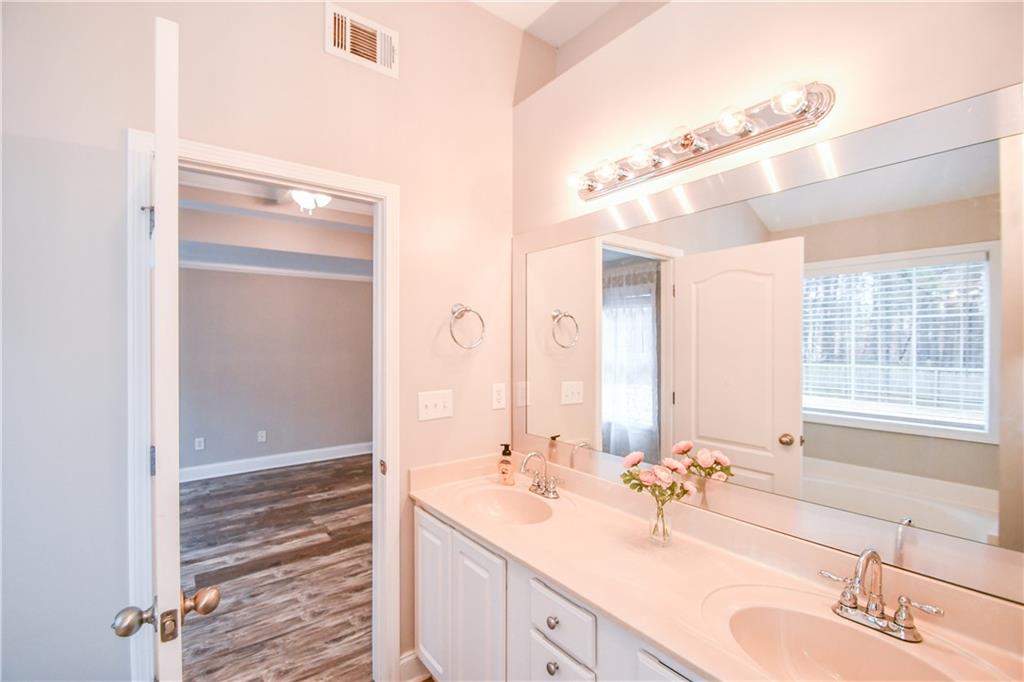 75 Ashebrooke Way Jefferson, GA 30549 - Photo 52 of 84 a bathroom with a sink double vanity and a mirror