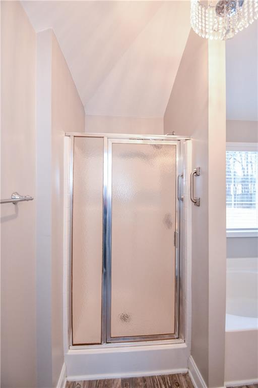 75 Ashebrooke Way Jefferson, GA 30549 - Photo 53 of 84 a bathroom with a glass shower door