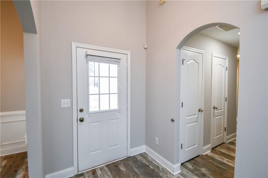 75 Ashebrooke Way Jefferson, GA 30549 - Photo 6 of 84 a view of a livingroom with wooden floor and a bathroom