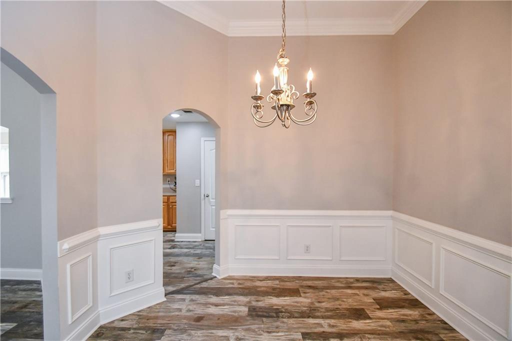 75 Ashebrooke Way Jefferson, GA 30549 - Photo 9 of 84 a view of empty room with wooden floor and ceiling fan